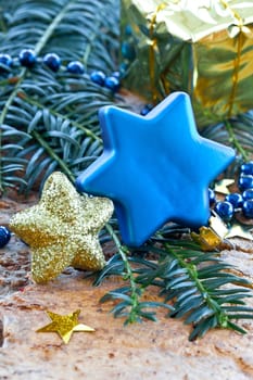 Decoration in blue and gold for Christmas on fir branches
