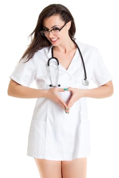 Female doctor doing a heart with her hands.