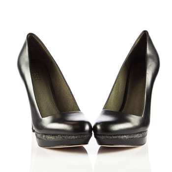 Elegant high heel shoes on white background. Black footwear.