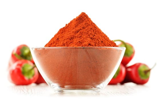 Glass bowl with red hot chili pepper isolated on white