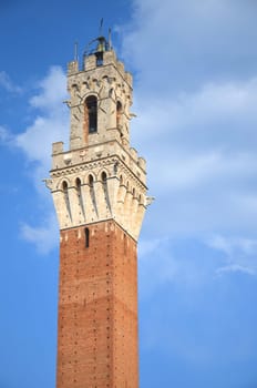 The tower of Palazzo Pubblico on Piazza del Campo in Siena, Tuscany, Italy