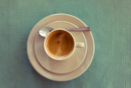 Cup of espresso on a green napkin