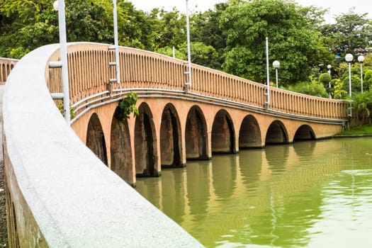Wall of bridge across the canal at garden