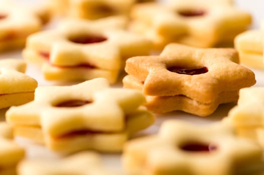 Freshly baked Christmas cookies star with jam