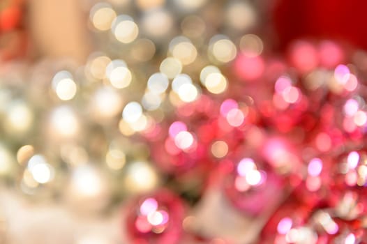 Blurred shiny silver and pink Christmas background balls