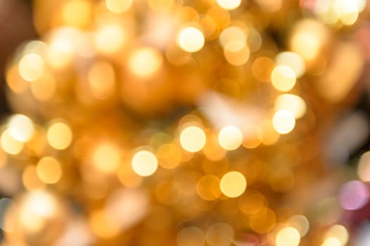 Glittering golden Christmas background blurred