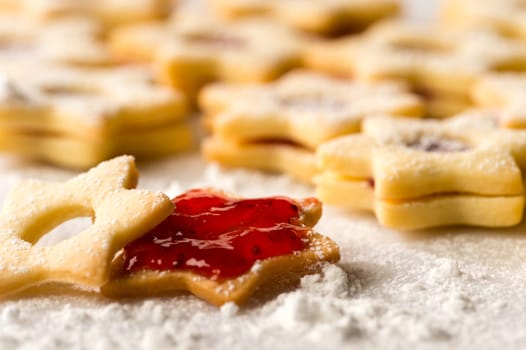 Homemade Christmas cookies star with strawberry jam