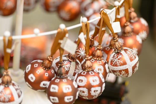 Hanging glittering bronze Christmas decorations bulbs