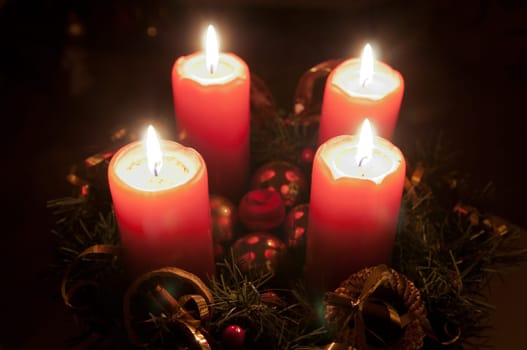 Christmas advent wreath with burning candles