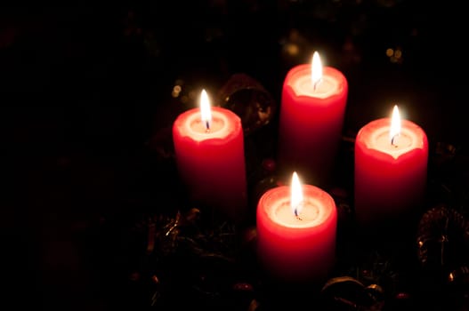 Christmas advent wreath with burning candles
