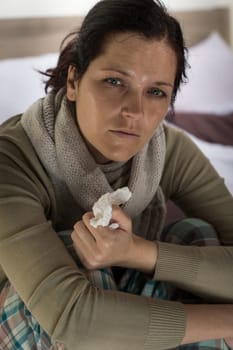 Young woman having fever and sweating