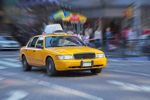 Yellow cab in New York street. Blurred background.