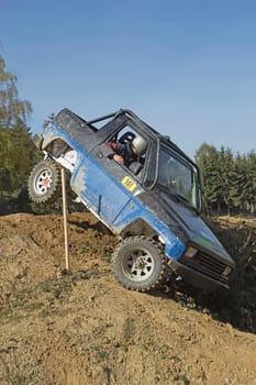 MOHELNICE, CZECH REPUBLIC - OCT 05. Blue off-road car on a trial race in the "BIG SHOCK CUP Trial 2013"" on October 05, 2013 in Mohelnice, Czech Republic."
