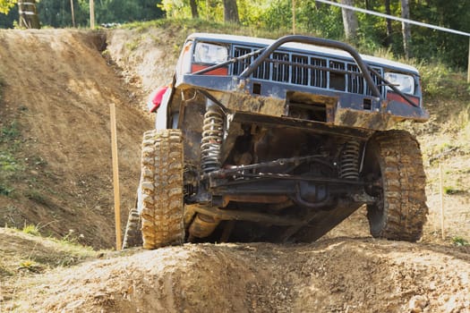 MOHELNICE, CZECH REPUBLIC - OCT 05. Off-road car in difficult terrain  on a trial race in the "BIG SHOCK CUP Trial 2013"" on October 05, 2013 in Mohelnice, Czech Republic."