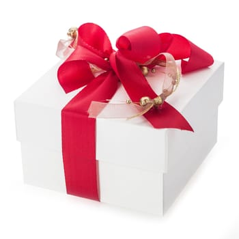 Close up of a plain white gift box with two decorative red and gold bows for celebrating Christmas, Valentines, birthday or an anniversary over a white background