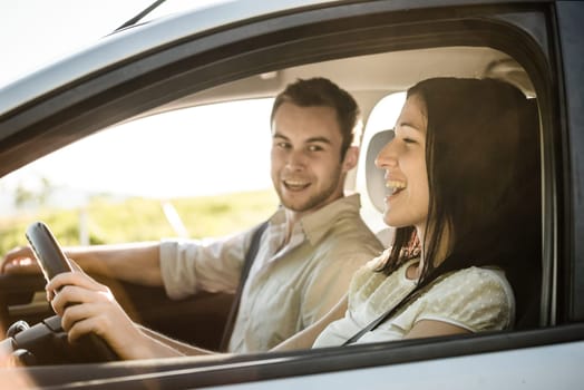 Happy time together - couple in car singing song