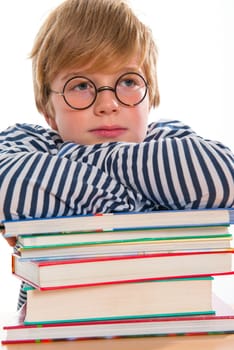 boy with books is reflecting
