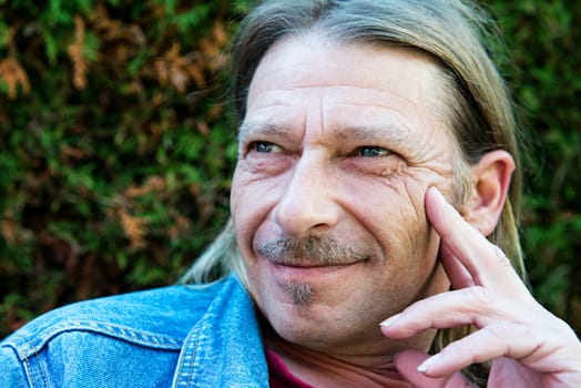 friendly man with long hair