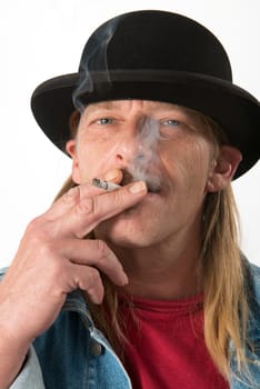 Man with bowler hat is smoking