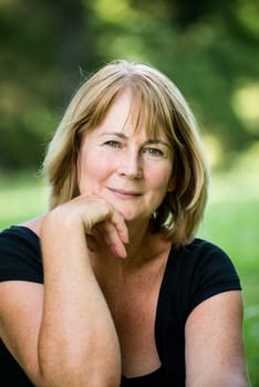 Portrait of attractive senior woman - outdoor on sunny day