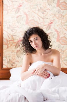 Pretty woman cross arms before herself while sitting