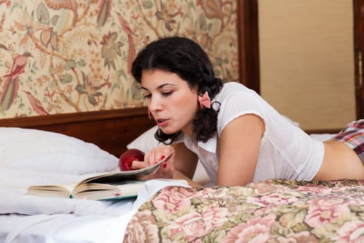 Woman in schoolgirl dress read book with interest