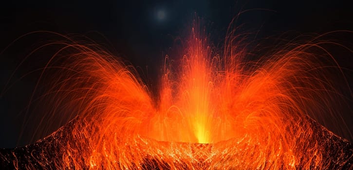 Volcano erupting at night with a very strong eruption