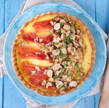 homemade tart with ham,cheese,nuts and thyme