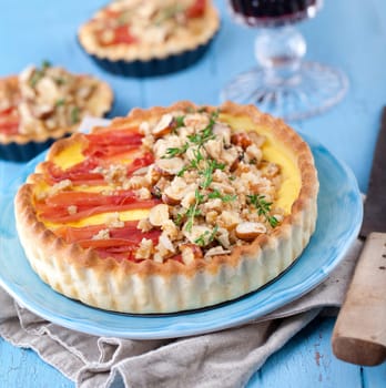 homemade tart with ham,cheese,nuts and thyme