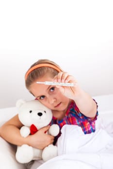 Cute girl doctor with teddy bear