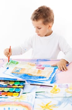 Casual schooboy painting with watercolor on white background