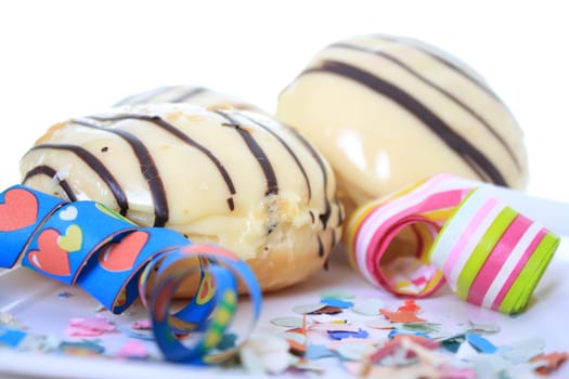 Berliners covered with icing and chocolate