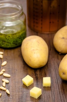 Potatoes and ingredients for a soup in portrait format