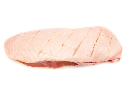 Raw duck breast with skin on white background