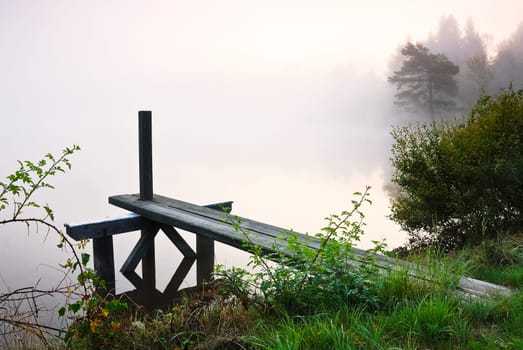 Morning at the lake with jetty