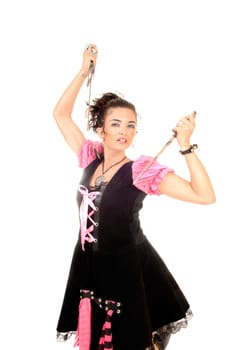 A lovely young woman kneeling and holding two swords,.looking serious, in closeup for white background..