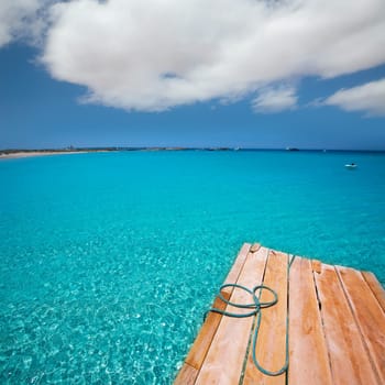 Formentera Ses Illetes beach pier Illetas with Ibiza background at balearic islands