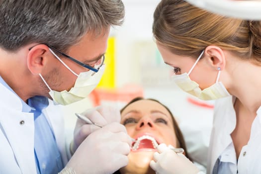 Experienced dentist in his practice