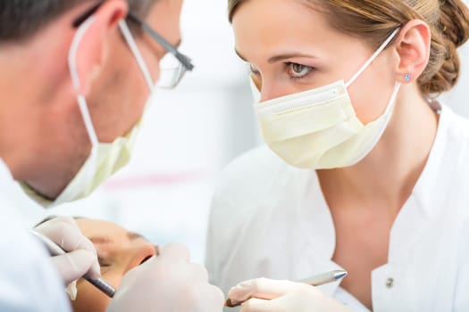 Experienced dentist in his practice