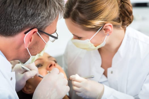 Experienced dentist in his practice