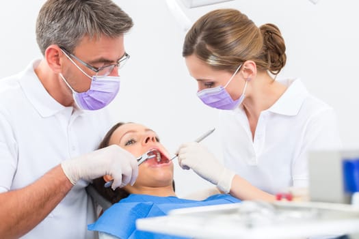 Experienced dentist in his practice