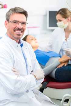 Experienced dentist in his practice