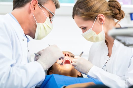 Experienced dentist in his practice