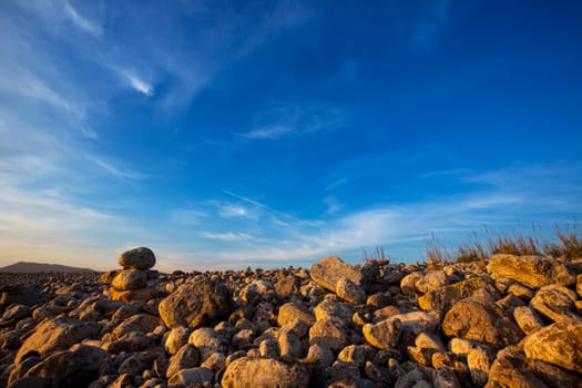 Ibiza Cap des Falco beach rolling stones in Sant Josep Balearic Islands