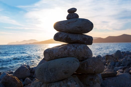 Ibiza Cap des Falco sunset with desire stones at the beach in Sant Josep Balearic Islands
