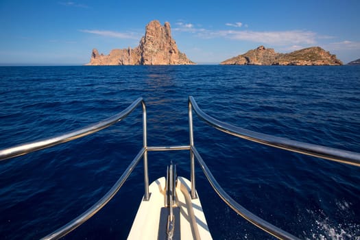 Boating sailing in Ibiza near es Vedra island on Mediterranean sea of Balearic