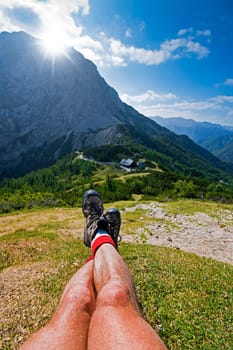 Hiker resting in mountains on a beautiful sunny day