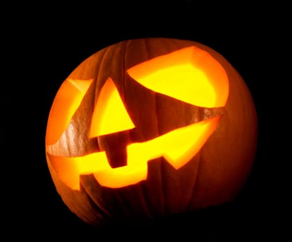 Jack O Lantern halloween pumpkin on black background