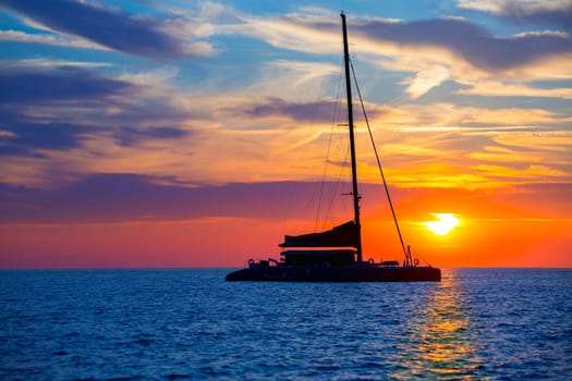 Ibiza san Antonio Abad de Portmany catamaran sailboat sunset with in Balearic islands of spain
