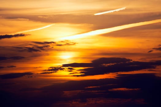 Ibiza sunset from Cala Conta Comte orange sky clouds